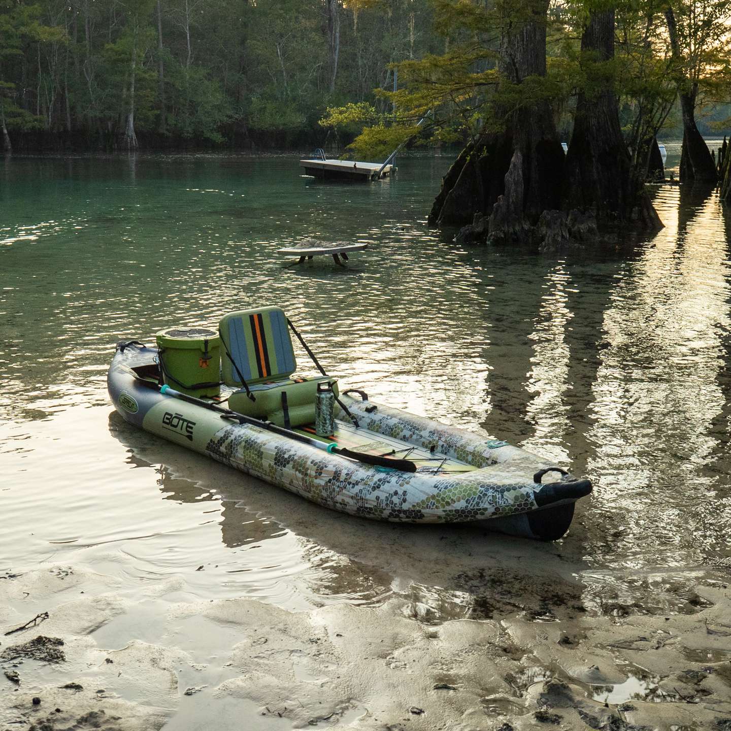 Bote Zeppelin Aero 12'6 Inflatable Kayak in Verge Camo colourway inflatable kayak shown on the water in a paddling lifestyle scene