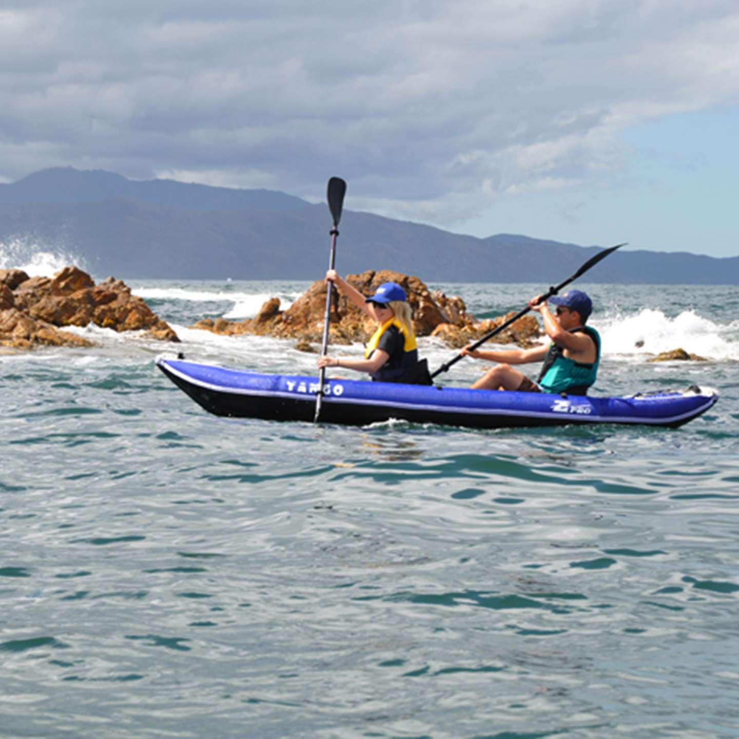 Z Pro Tango 2 man Inflatable Kayak Blue in blue inflatable kayak alternate lifestyle view highlighting the two-person paddling setup and stable touring shape
