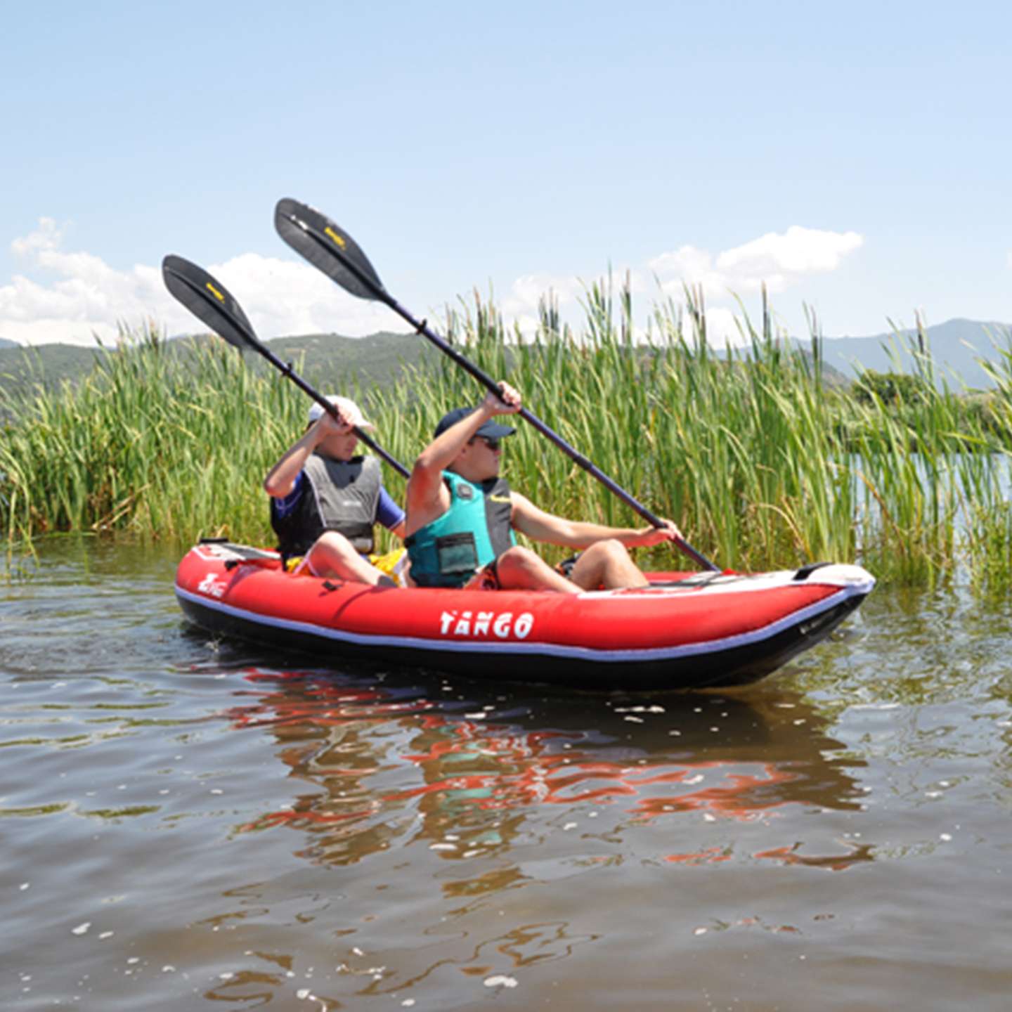 Z Pro Tango 2 man Inflatable Kayak Red in red inflatable kayak alternate lifestyle view highlighting the two-person paddling setup and stable touring shape