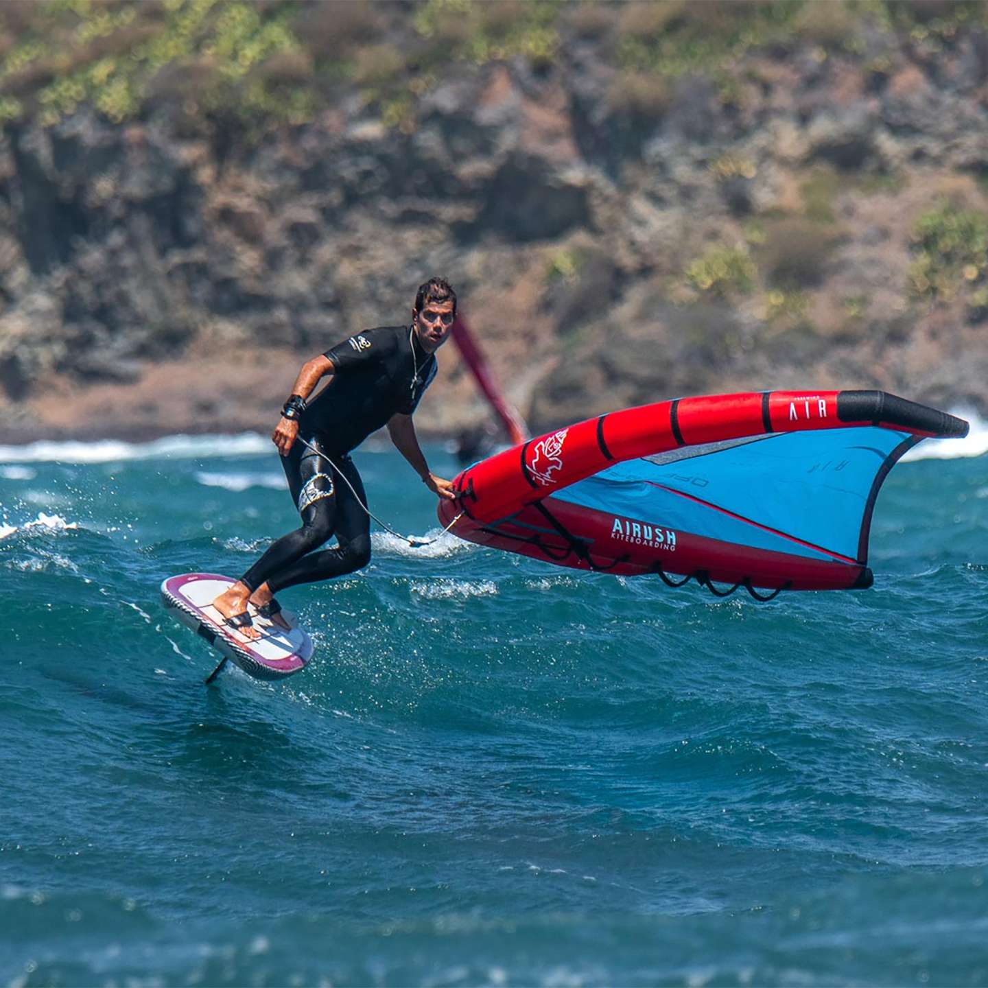 AK Compact Wing Foil Board 2022 deck view showing the EVA traction pad, stance area, rails and nose shape