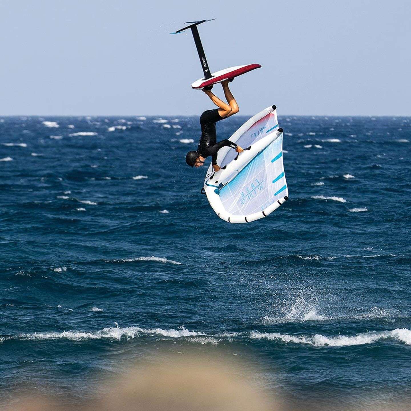 AK Compact v3 Wing Foil Board 2024 deck view showing the EVA traction pad, stance area, rails and nose shape