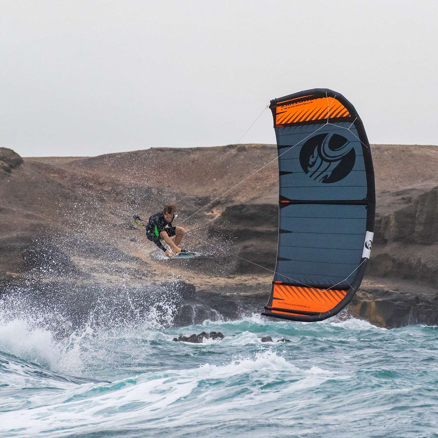 Cabrinha Switchblade 2021 Kite action image with the kite flying above the water, showing canopy shape, stability and on-water kitesurf performance