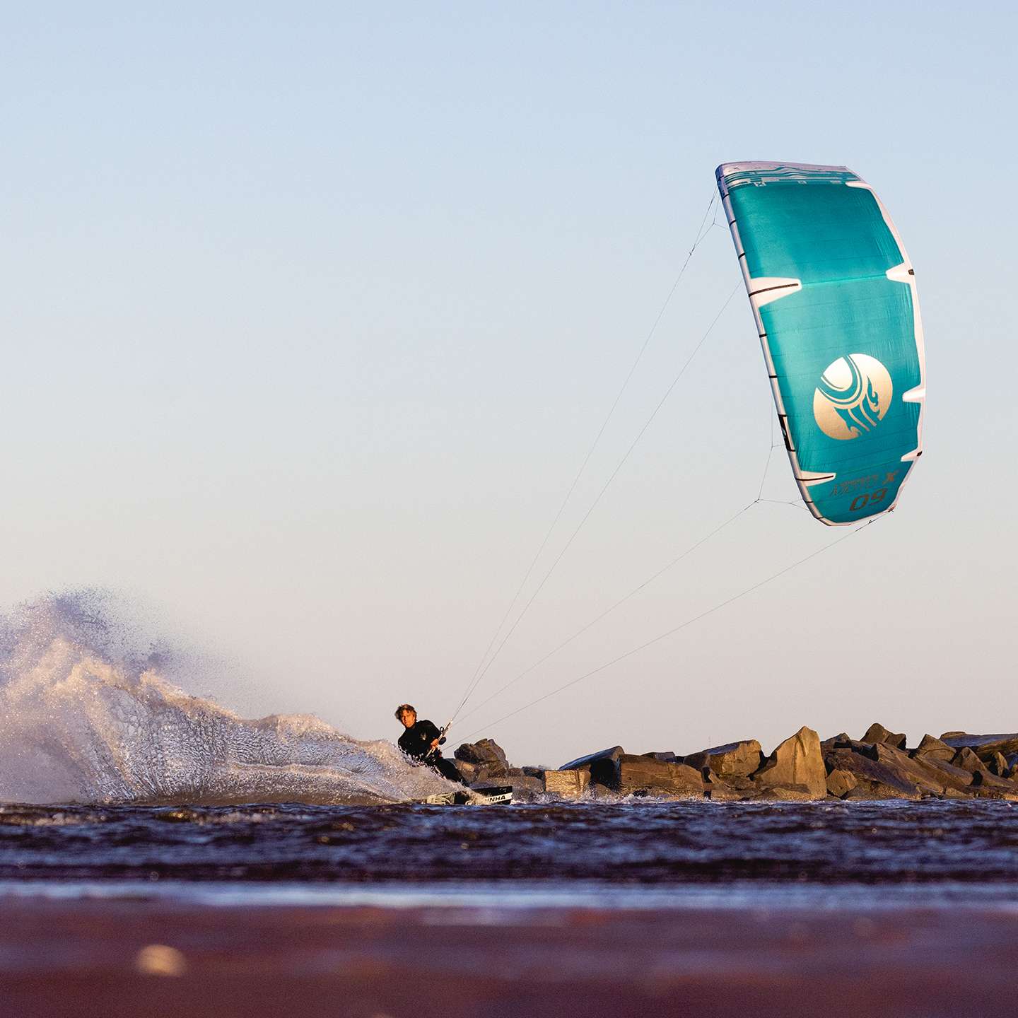 Cabrinha Moto X 2023 Kite profile view showing the inflated kite arc, swept wingtips, strut depth and aerodynamic canopy shape