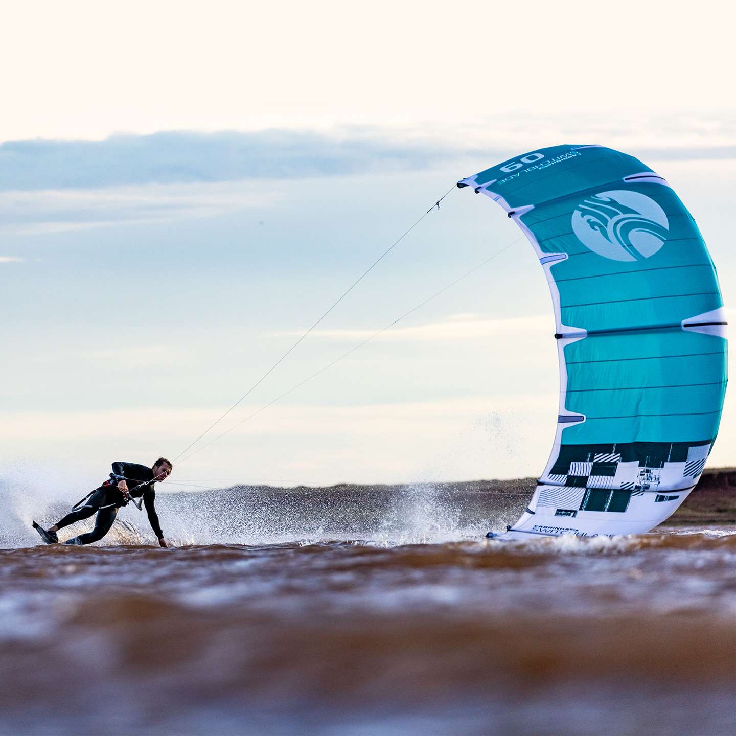 Cabrinha Switchblade 2023 Kite profile view showing the inflated kite arc, swept wingtips, strut depth and aerodynamic canopy shape