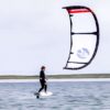 Cabrinha Moto X 2024 Kite action image with the kite flying above the water, showing canopy shape, stability and on-water kitesurf performance