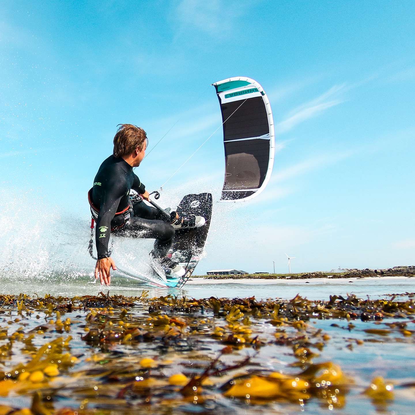 Cabrinha Moto XL Apex 2024 Kite profile view showing the inflated kite arc, swept wingtips, strut depth and aerodynamic canopy shape