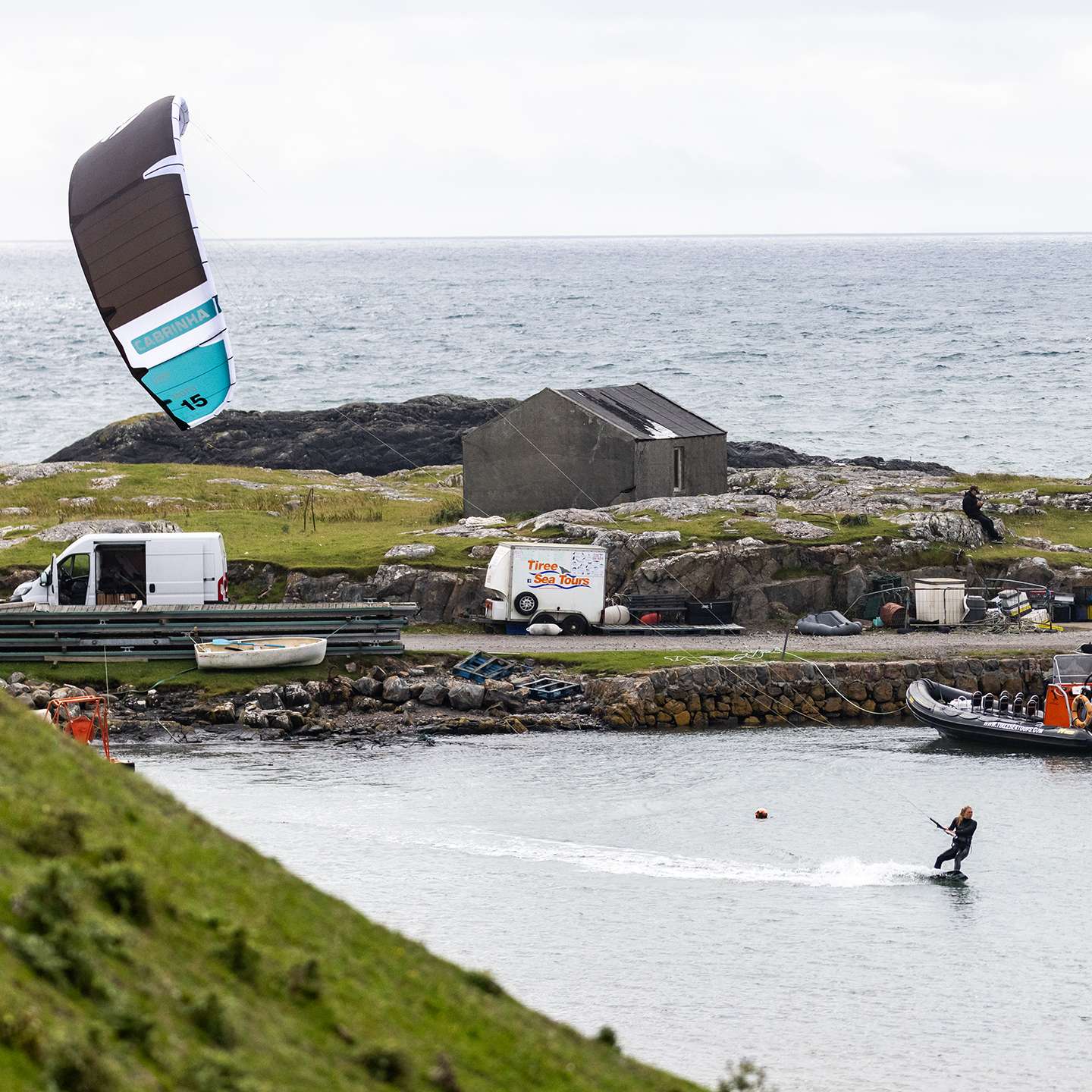 Cabrinha Moto XL Apex 2024 Kite action image with the kite flying above the water, showing canopy shape, stability and on-water kitesurf performance