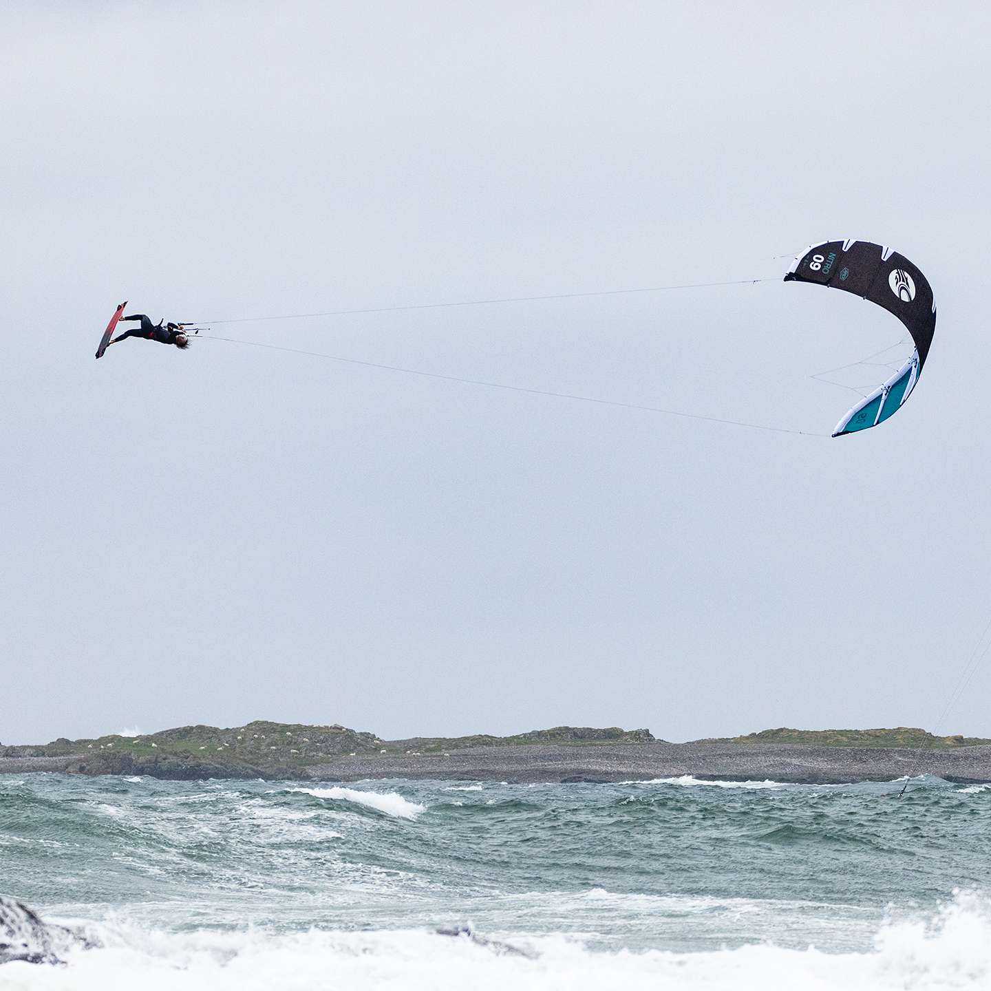 Cabrinha Nitro Apex 2024 Kite profile view showing the inflated kite arc, swept wingtips, strut depth and aerodynamic canopy shape