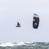 Cabrinha Nitro Apex 2024 Kite action image with the kite flying above the water, showing canopy shape, stability and on-water kitesurf performance