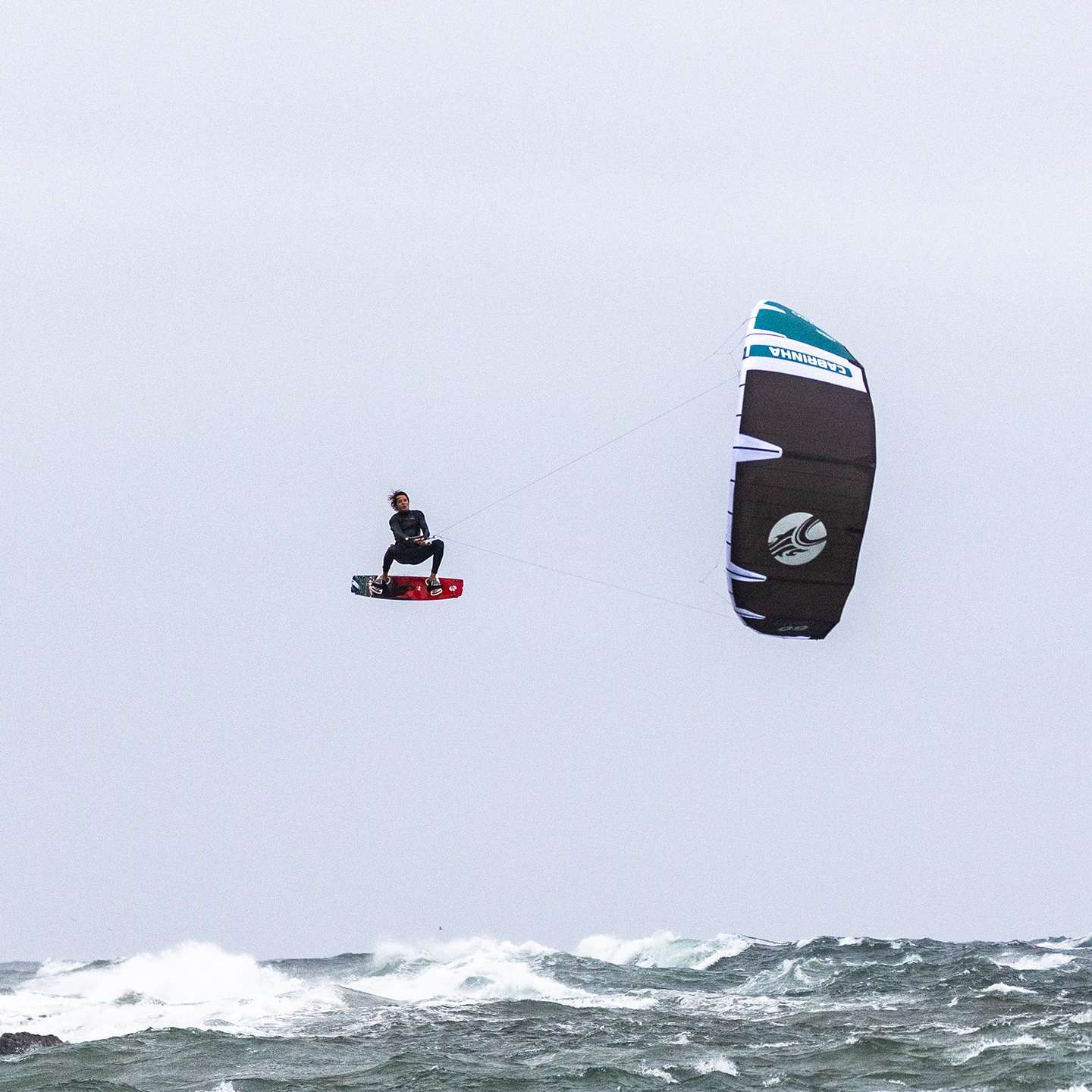 Cabrinha Nitro Apex 2024 Kite action image with the kite flying above the water, showing canopy shape, stability and on-water kitesurf performance