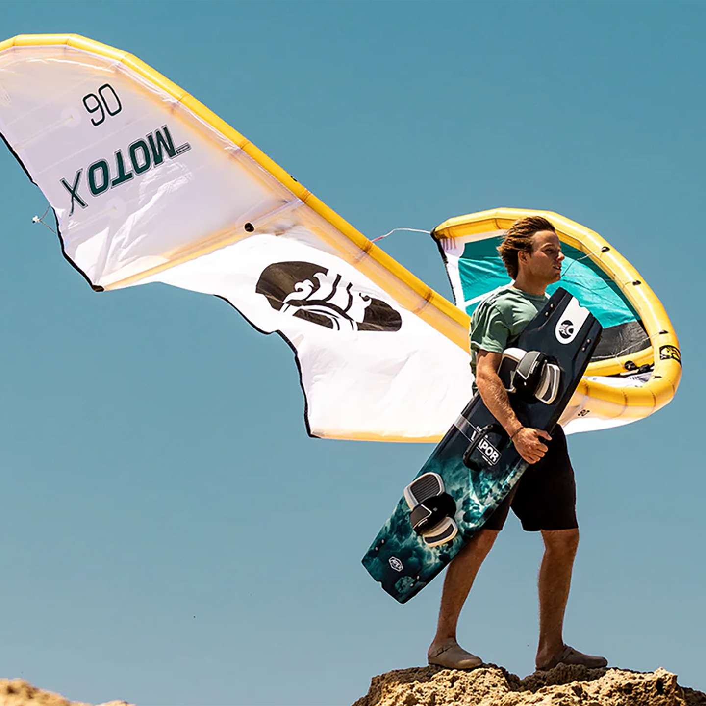 Cabrinha Moto X Design Works 2024 Kite action image with the kite flying above the water, showing canopy shape, stability and on-water kitesurf performance