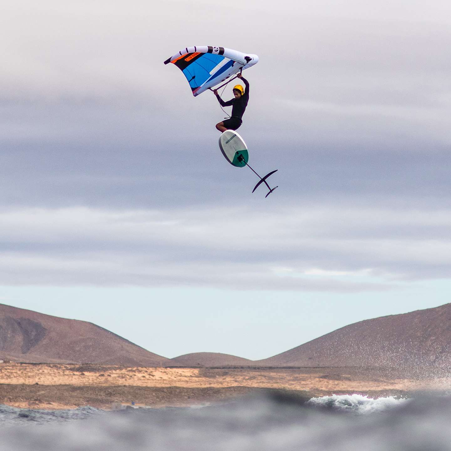 Cabrinha Vision 2025 Wing action image with the wing in use on the water, showing canopy shape, handles and wingfoiling performance