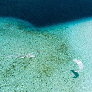 A view from above of a kitesurfer sailing a duotone kite