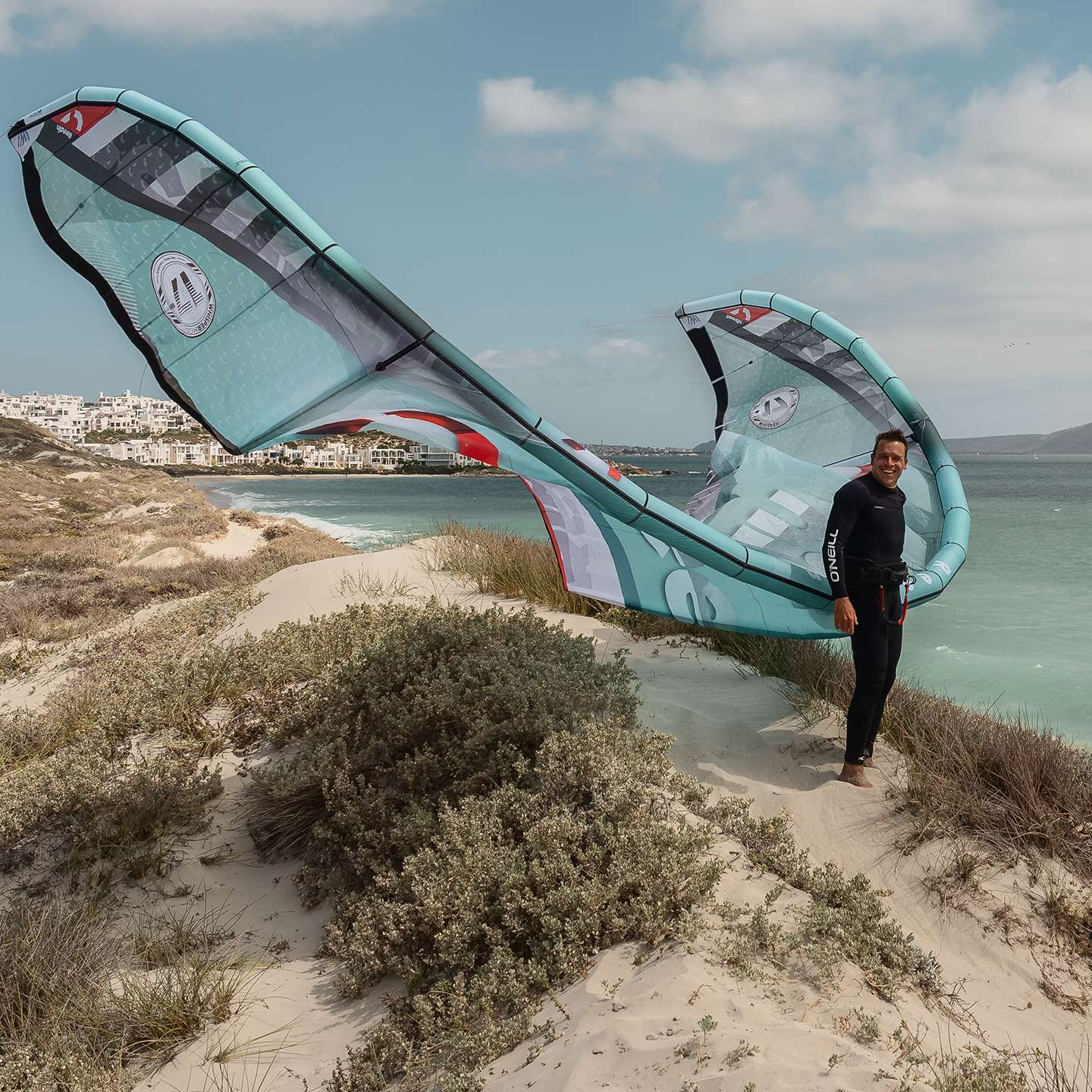 Reedin WHISPERModel 2025 Kite on-water action and lifestyle view