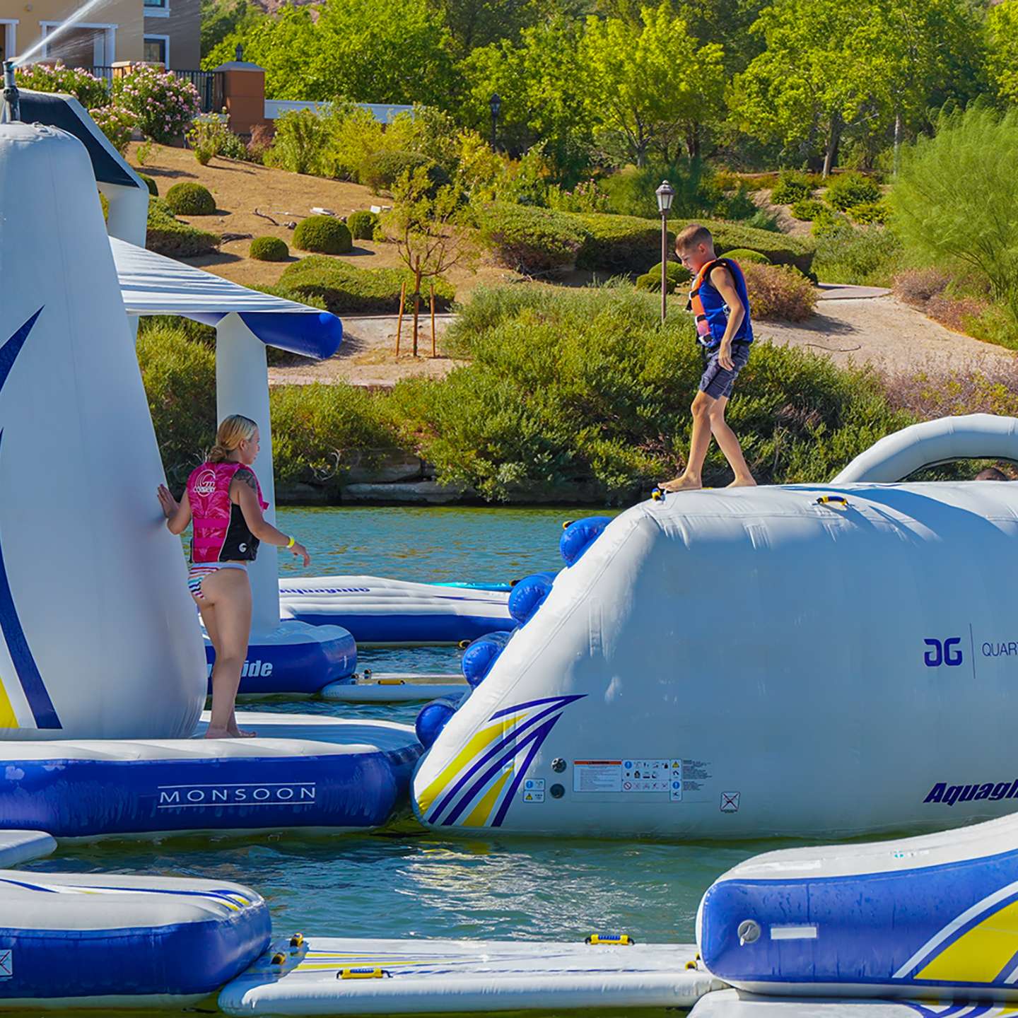 Aquaglide Quarterback inflatable aquapark module set up on the water as part of a modular floating aquapark course