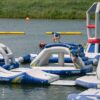 aquaglide-uni-archway-alt1-zoom Aquaglide Universal Archway inflatable aquapark module set up on the water as part of a modular floating aquapark course