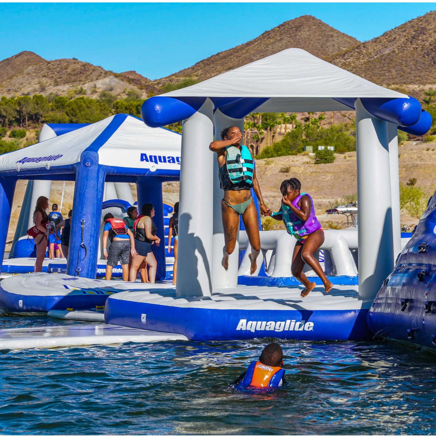 aquaglide-uni-pavillion-alt1-zoom Aquaglide Universal Pavillion inflatable aquapark module set up on the water as part of a modular floating aquapark course