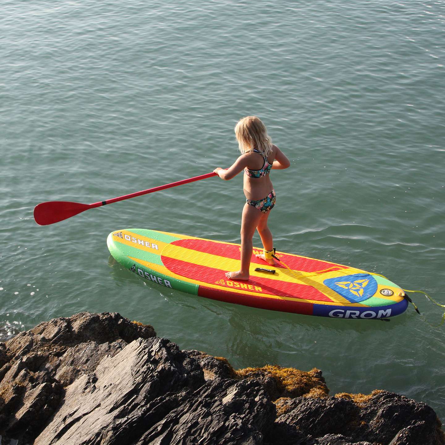 O'Shea 7'10 Grom QSx Inflatable SUP Board 2025 deck view showing traction pad, carry handle and board shape