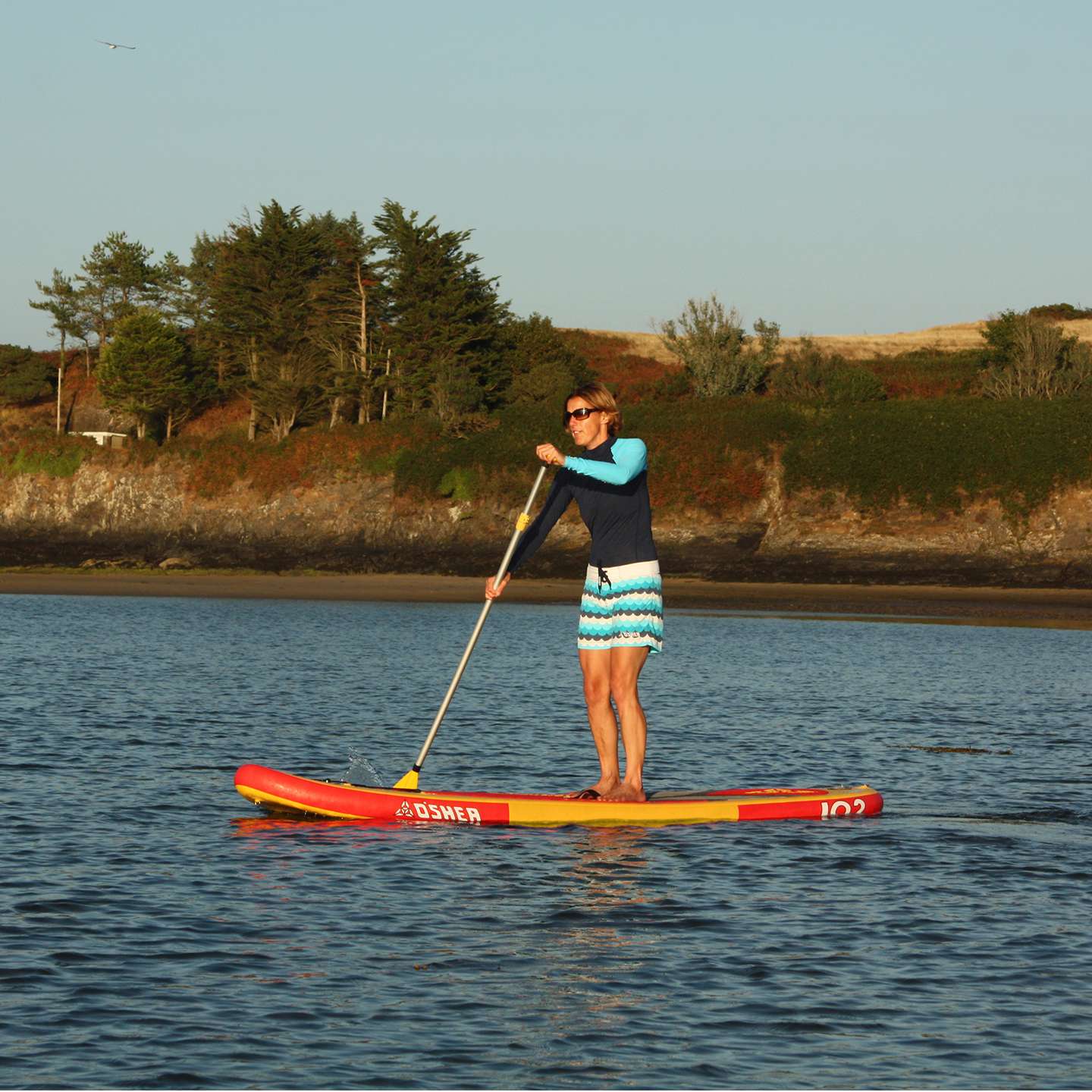 O'Shea 10'2 HDx Inflatable SUP 2025 deck view showing traction pad, carry handle and board shape