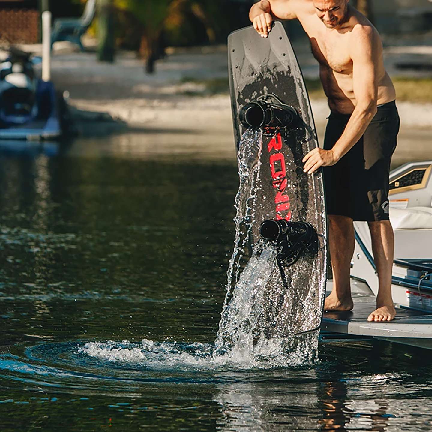 Ronix District 2026 Wakeboard lifestyle-style gallery image showing the wakeboard design