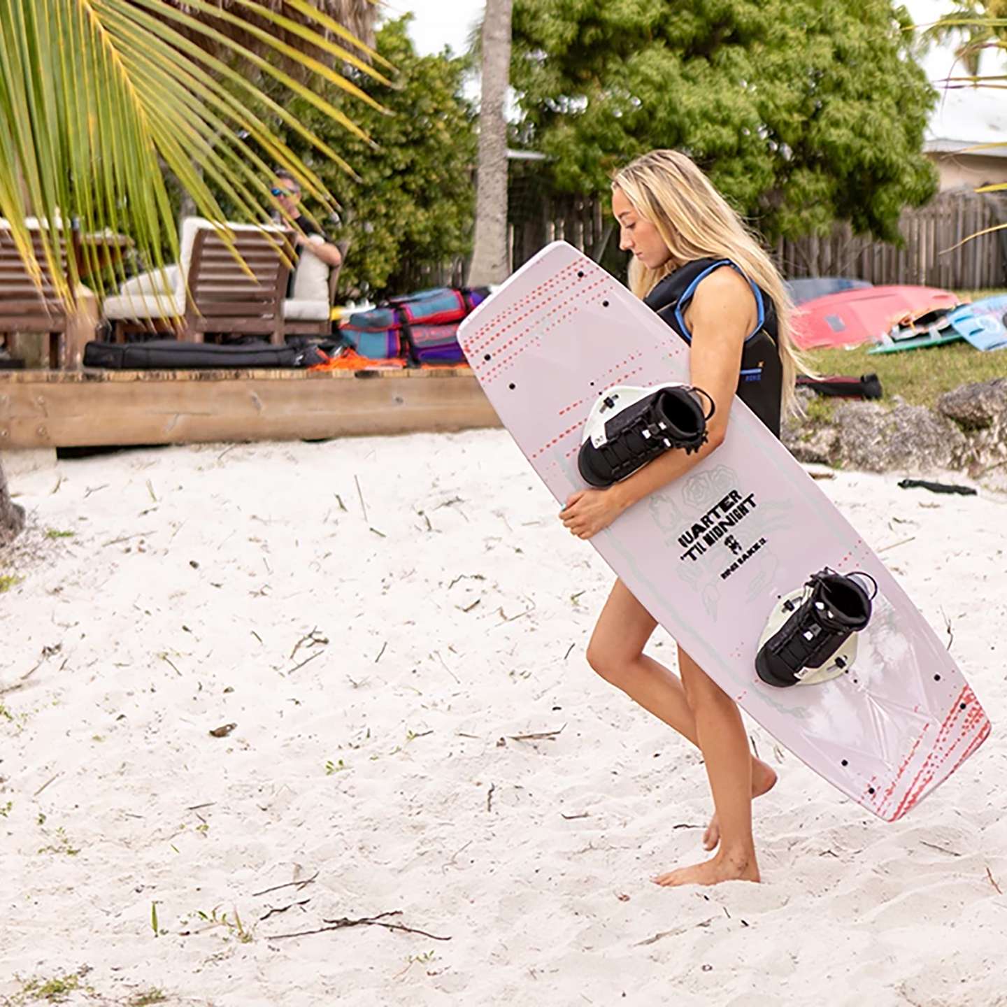 Ronix Quarter 'Til Midnight 2026 Wakeboard lifestyle-style gallery image showing the wakeboard design
