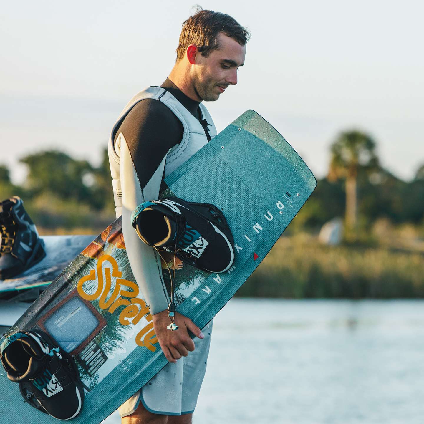 Ronix Supreme 2026 Wakeboard lifestyle-style gallery image showing the wakeboard design