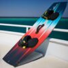 Shinn ADHD Prismatic Kiteboard 2023 base view showing the underside graphic, channels and rocker profile