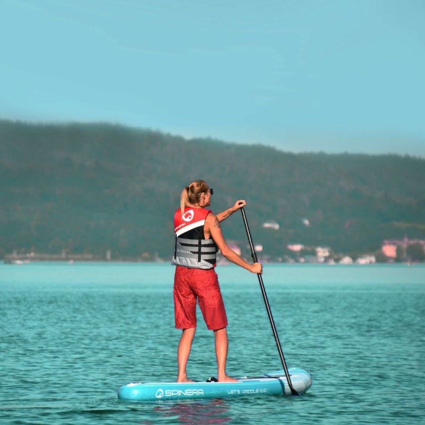 Spinera Lets Paddle 11'2 Inflatable SUP Package inflatable stand up paddle board lifestyle view of the inflatable paddle board set up for flat-water paddling
