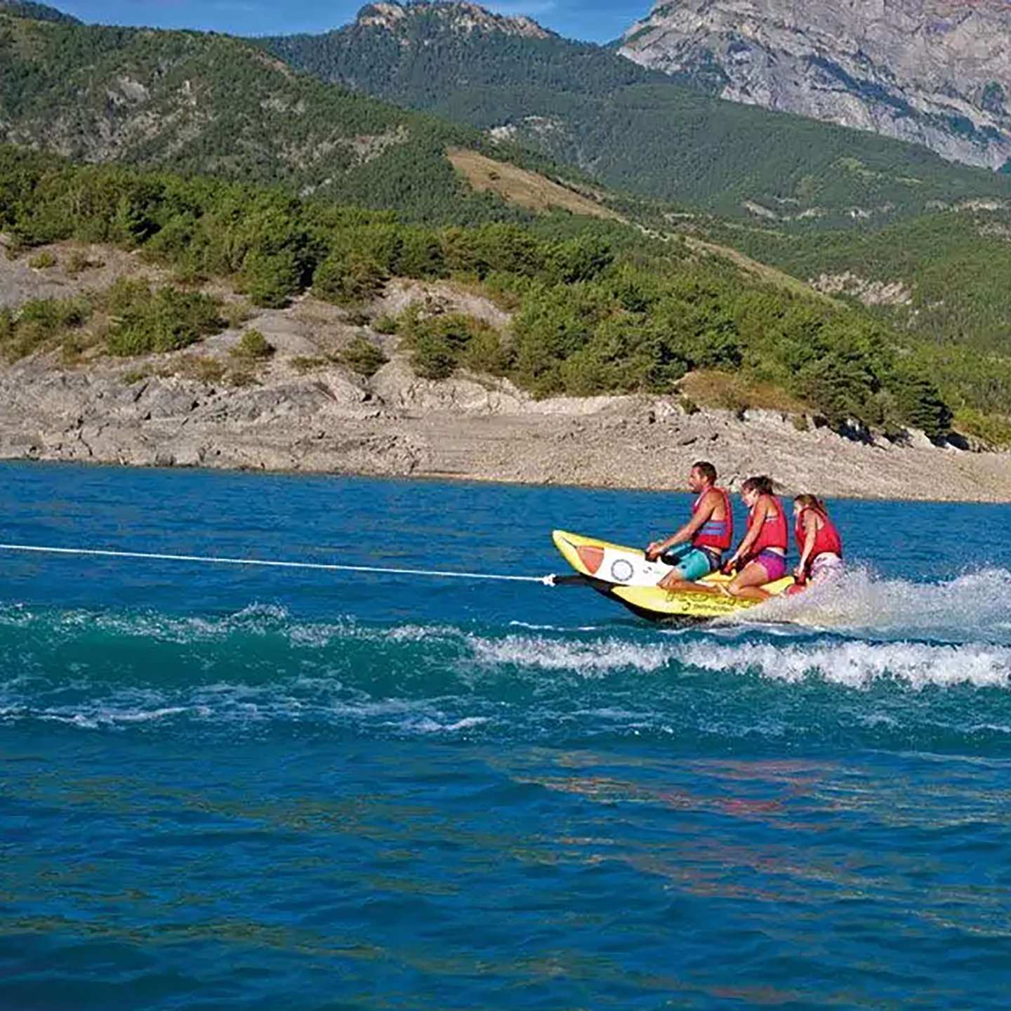 spinera-rocket-3-tube-alt1-zoom Spinera Rocket 3 Inflatable Watersled inflatable towable water tube lifestyle view of the towable tube inflated and ready for use behind a boat