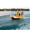 spinera-rocket-4-tube-alt1-zoom Spinera Rocket 4 Inflatable Watersled inflatable towable water tube lifestyle view of the towable tube inflated and ready for use behind a boat