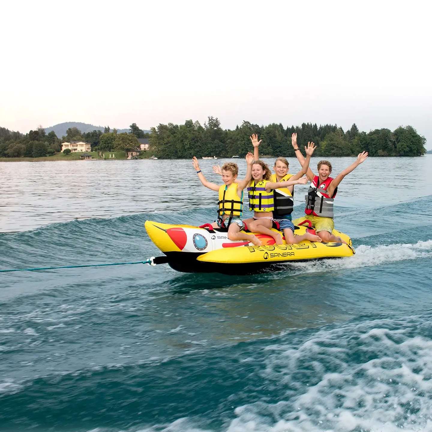 spinera-rocket-4-tube-alt1-zoom Spinera Rocket 4 Inflatable Watersled inflatable towable water tube lifestyle view of the towable tube inflated and ready for use behind a boat
