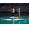 Spinera SUPVENTURE SUNSET iSUP inflatable stand up paddle board lifestyle view of the inflatable paddle board set up for flat-water paddling