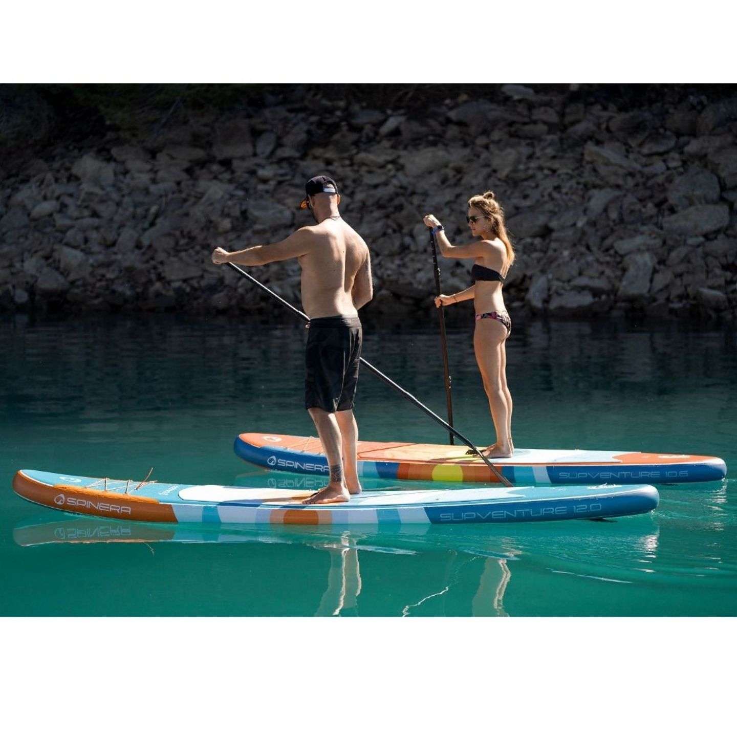 Spinera SUPVENTURE SUNSET iSUP inflatable stand up paddle board lifestyle view of the inflatable paddle board set up for flat-water paddling