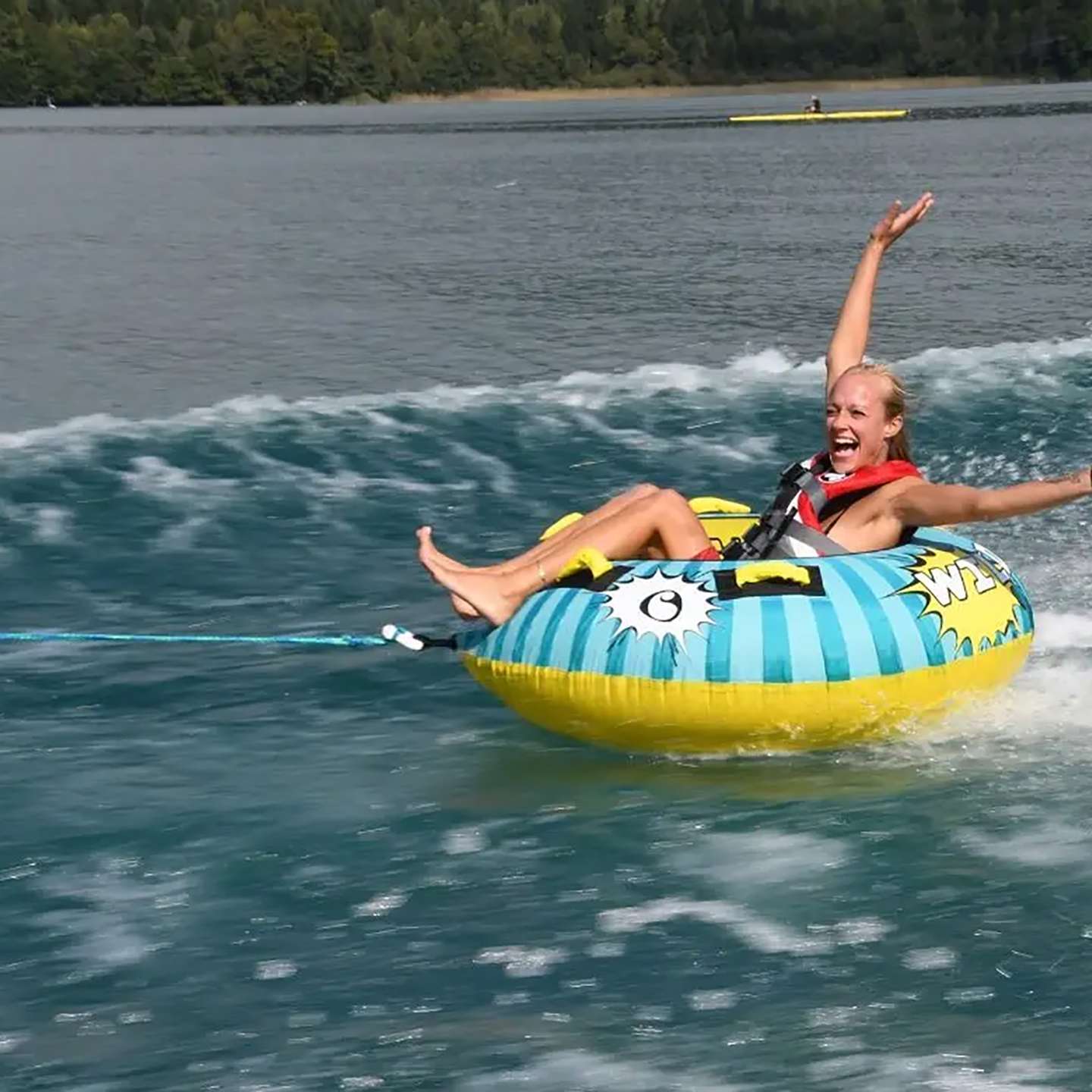 Spinera Wild Bob Inflatable Tube inflatable towable water tube on-water style image highlighting the handles, seating area and inflatable deck shape