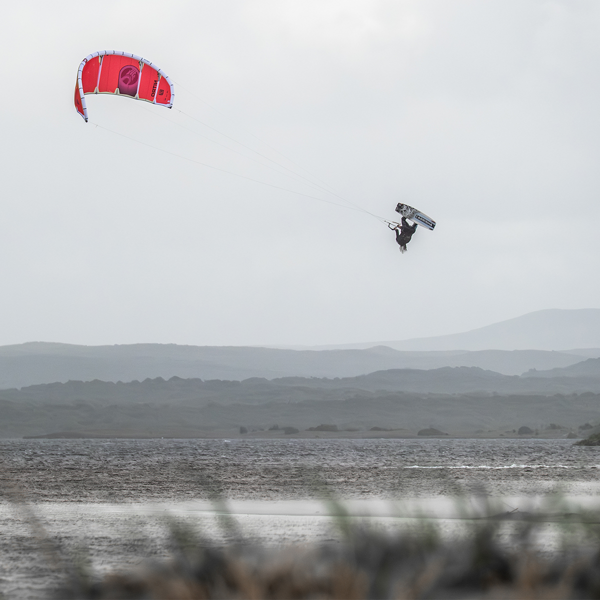 Cabrinha Nitro Apex 2026 Kite action image with the kite flying above the water, showing canopy shape, stability and on-water kitesurf performance