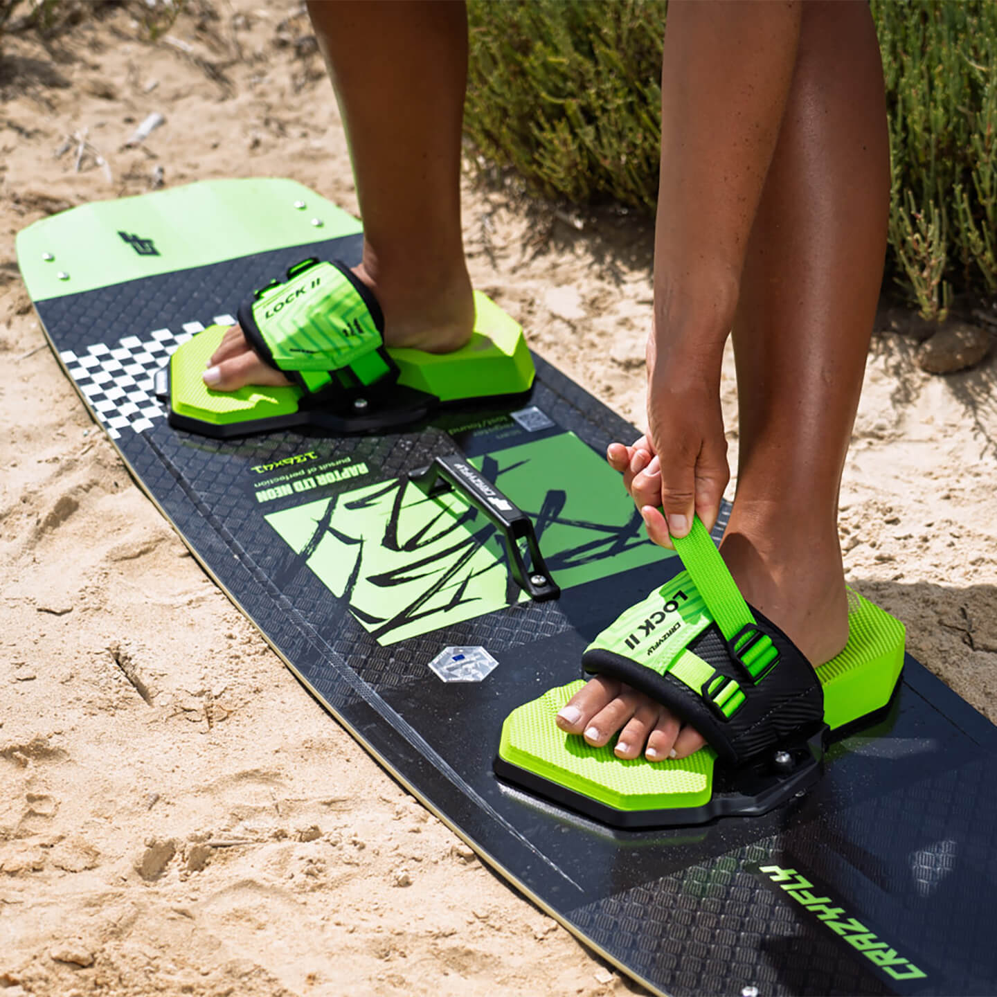 Crazyfly Lock II Bindings in green colour option angled view showing the foot straps and footbed shape