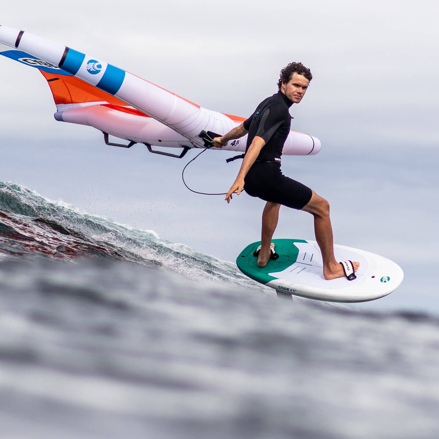 Cabrinha Code Wing Foil Board 2025 deck view showing footpad area, stance inserts, rail outline, nose and tail shape and board graphics