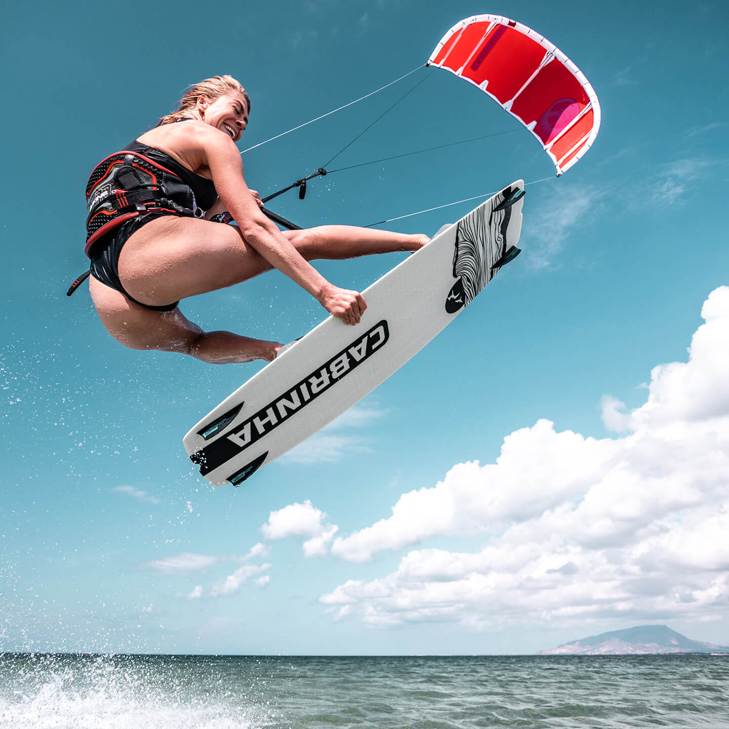 Cabrinha Spectrum 2026 Kiteboard profile view showing the inflated kite arc, swept wingtips, strut depth and aerodynamic canopy shape
