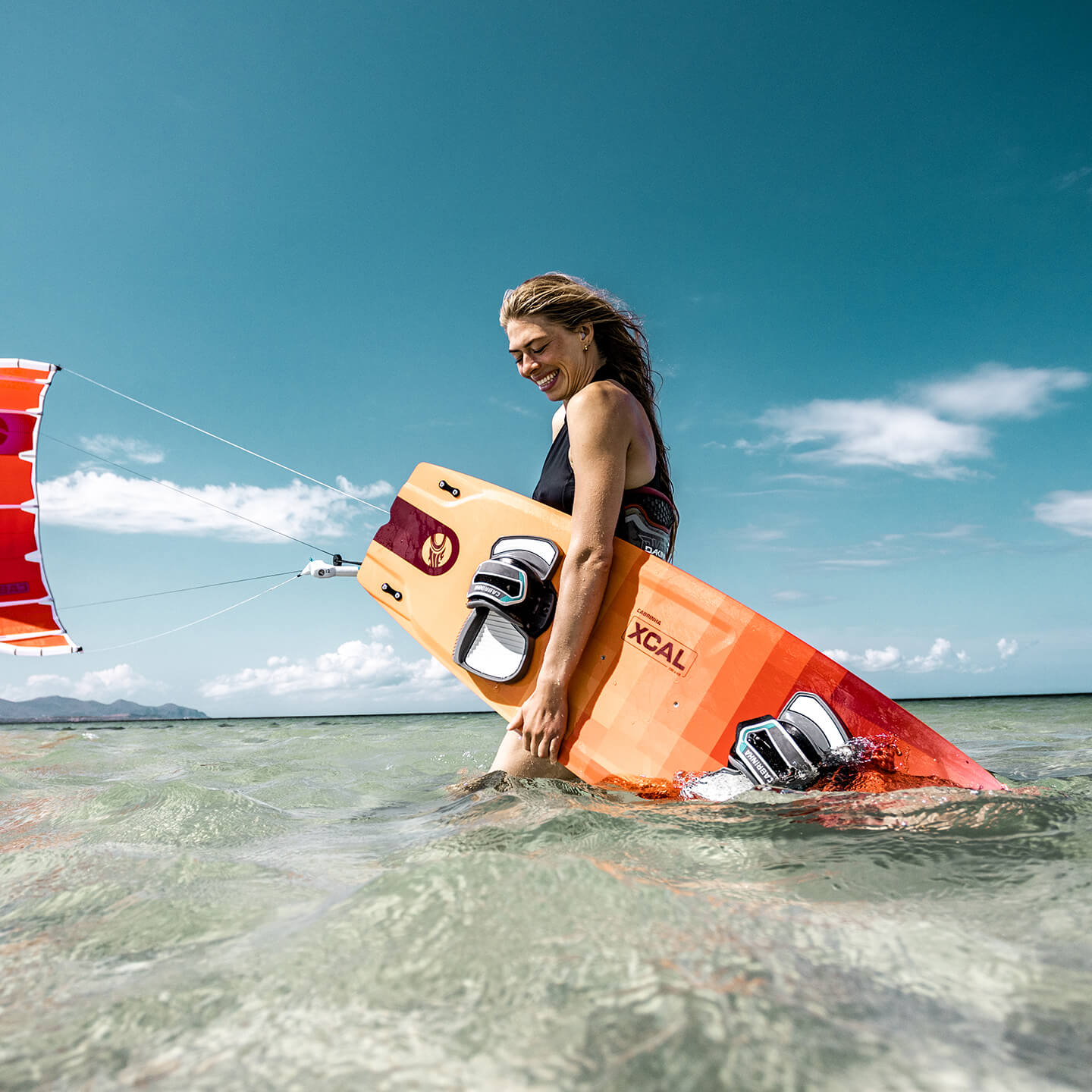 Cabrinha XCal 2026 Kiteboard profile view showing the inflated kite arc, swept wingtips, strut depth and aerodynamic canopy shape
