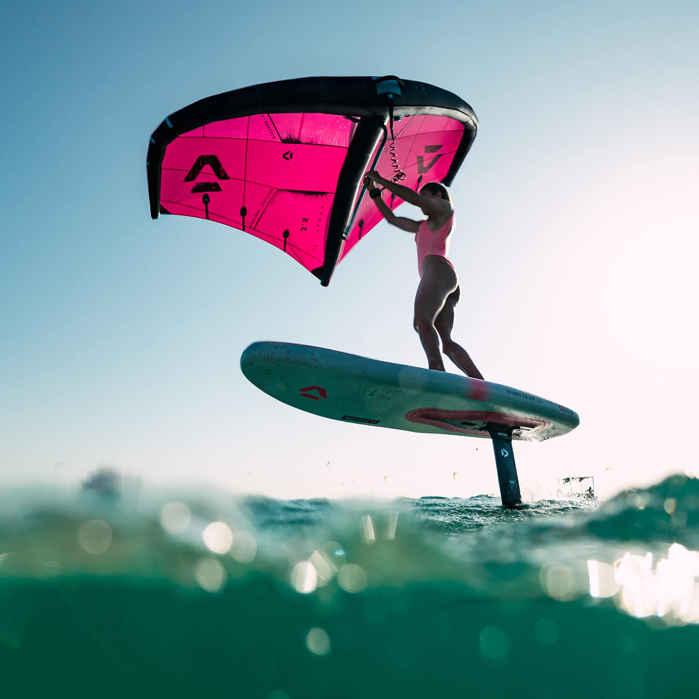 Duotone Skybrid Air Inflatable Foil Board 2026 on-water foil boarding action photo