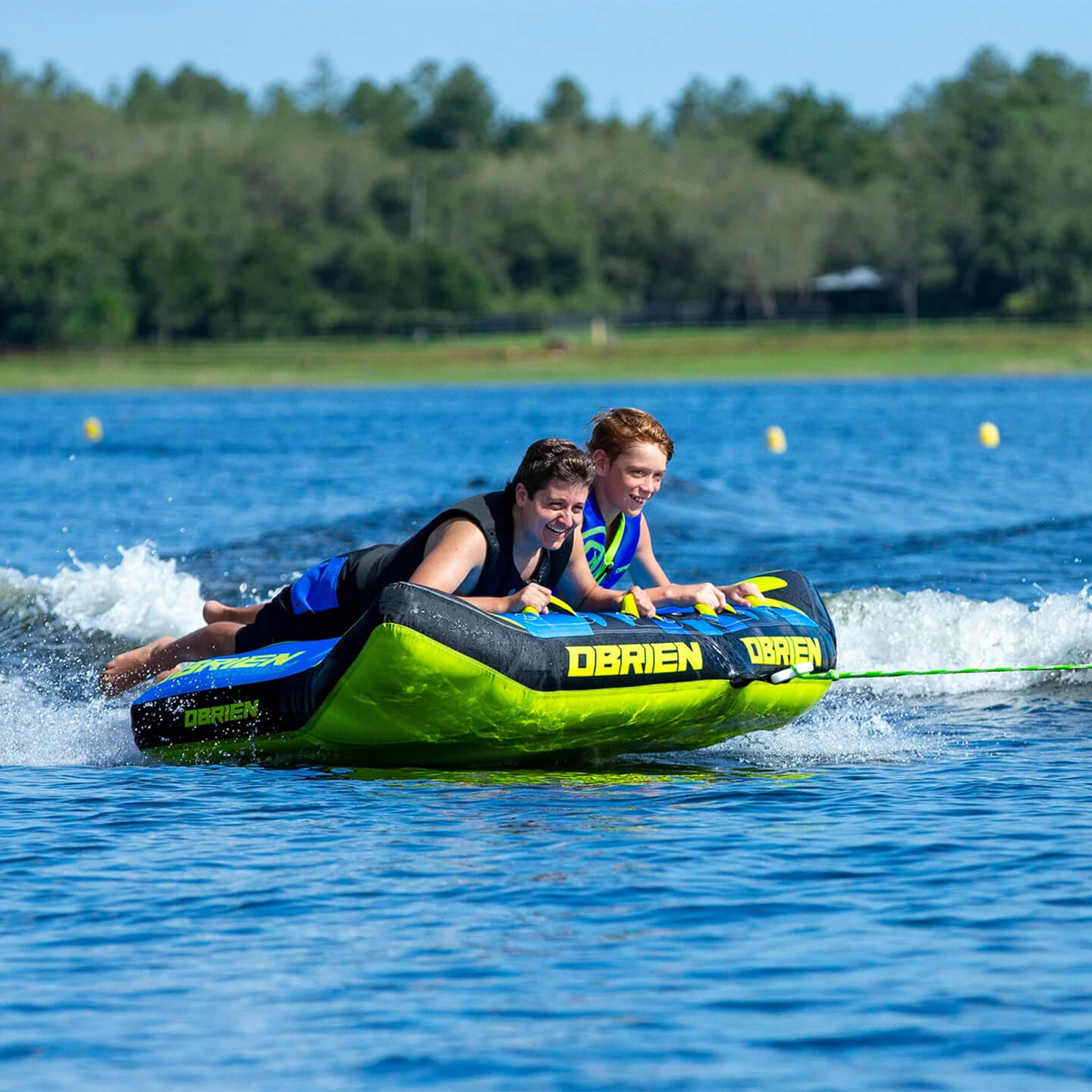 O'Brien Bat Wing 2 Inflatable Tube towable tube action image showing riders being towed on the water