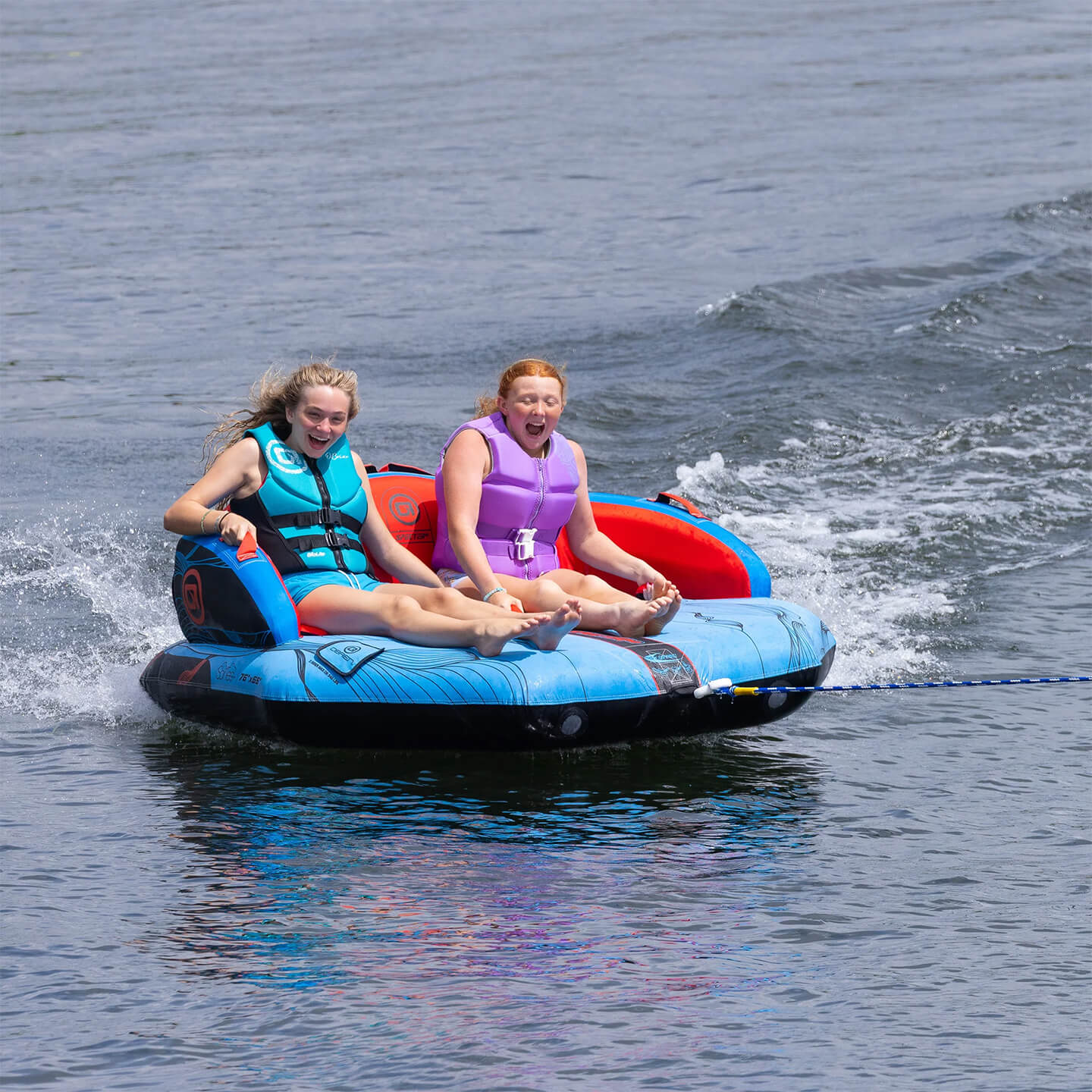 obrienspecter2tubealt4 O'Brien Specter 2 Inflatable Tube towable tube action image showing riders being towed on the water