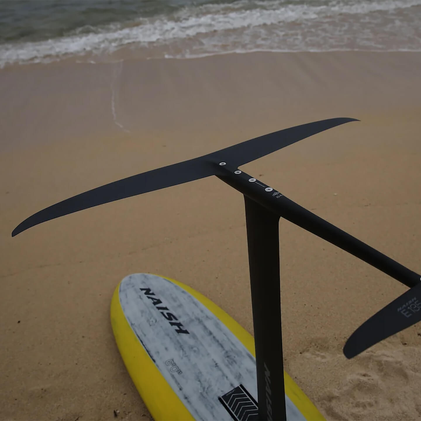 Naish Excalibur Front Wing 2026 set up on beach