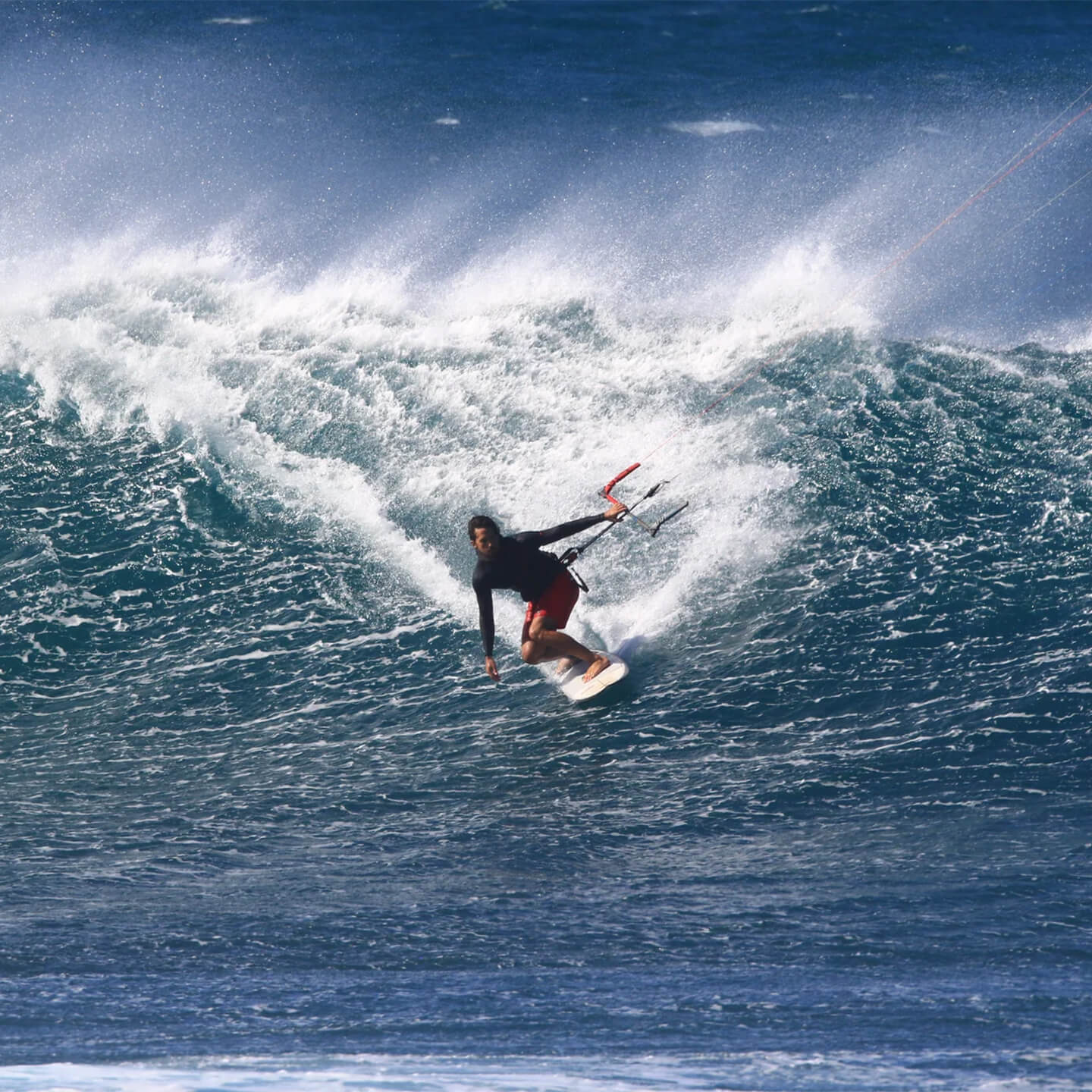 Naish Kokomo Kite Surfboard 2026 riding wave shot