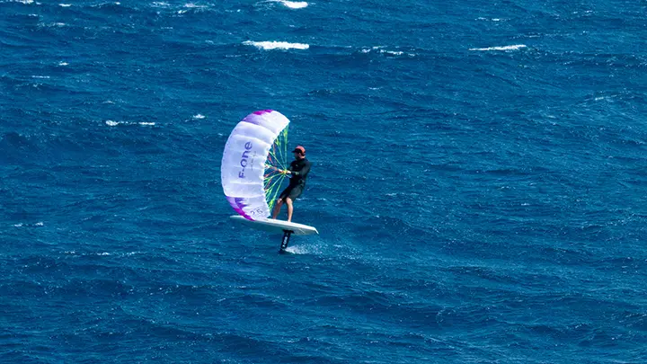 The F-One Frigate V2 sailing through waves